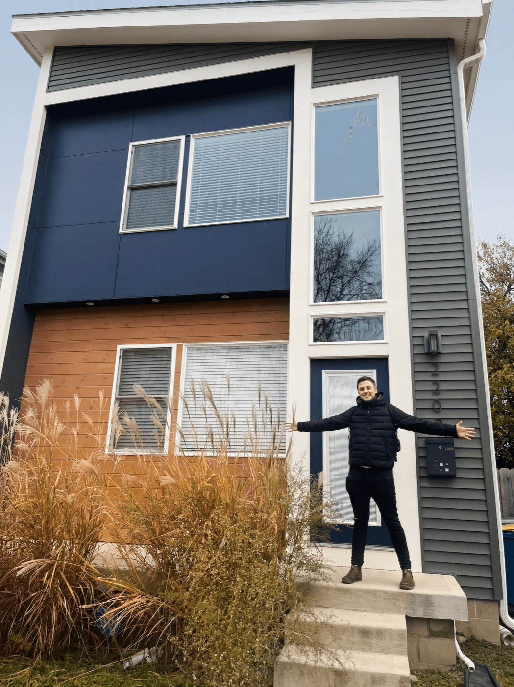 Guy standing in front of an Algu Hospitality property